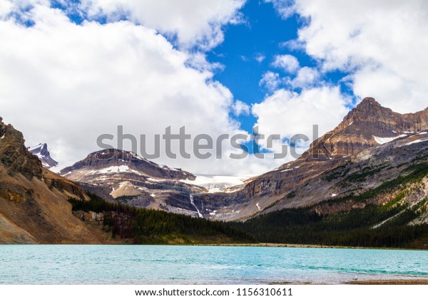 Bow Glacier with waterfalls in Banff National Park.\
Bow Glacier is an outflow glacier from the Wapta Icefield along the\
Continental Divide, and glacier runoff supplies water to Bow\
Lake.