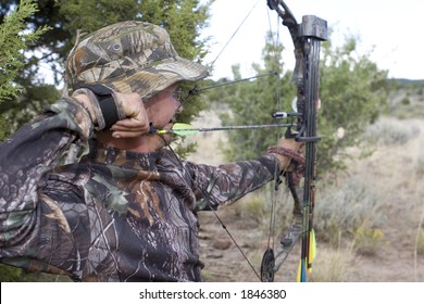 Bow Hunter ready to shoot at big game animal with compound bow - Powered by Shutterstock