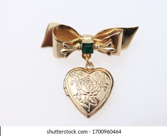 Bow with ornate etched heart locket vintage gold tone brooch