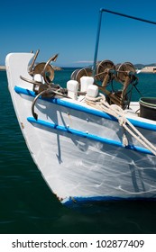 Bow of small fishing boat in a harbor