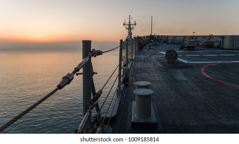 A Bow View From A Navy Frigate In Port During A Cold And Foggy Morning In A Naval Base. Bow View Of A Navy Ship