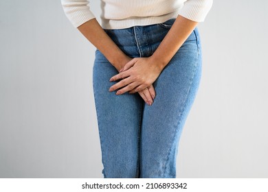 Bowel Incontinence Pain. Woman Hand Holding Crotch