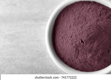 Bowl With Acai Powder On Table