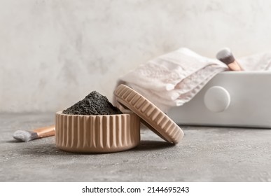 Bowl Of Activated Carbon Powder For Facial Mask On Light Background