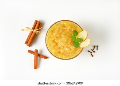 Bowl Of Apple Sauce And Spice On White Background