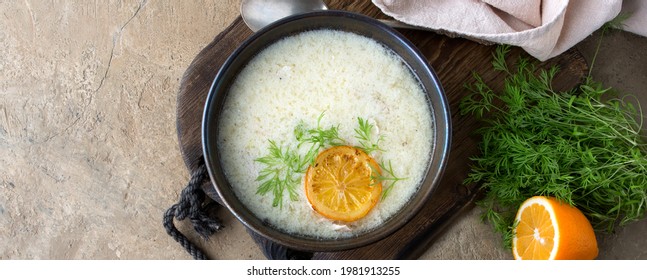 A Bowl Of Avgolemono Greek Chicken Soup On The Table