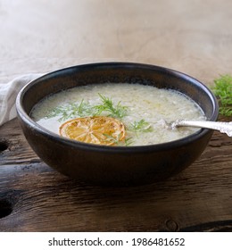 A Bowl Of Avgolemono Greek Chicken Soup On The Table