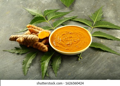 Bowl Of Ayurveda  Herbal Face Pack With Turmeric And Neem Tree Leaves.