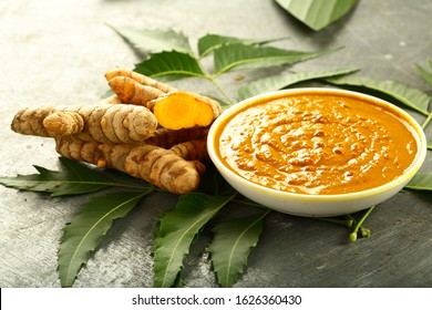 Bowl Of Ayurveda  Herbal Face Pack With Turmeric And Neem Tree Leaves.