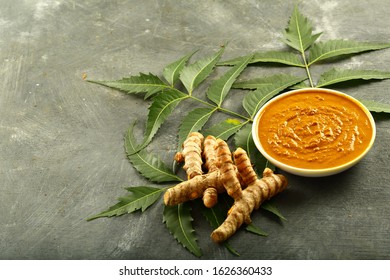 Bowl Of Ayurveda  Herbal Face Pack With Turmeric And Neem Tree Leaves.