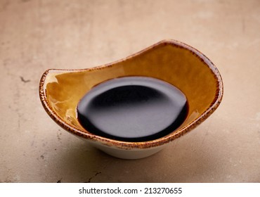 Bowl Of Balsamic Vinegar Cream On Kitchen Table