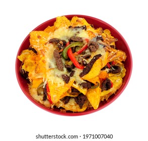 Bowl Of Beef And Cheese Nachos With Red And Green Peppers Isolated On A White Background