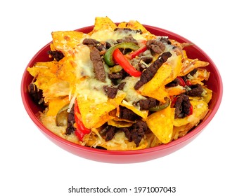 Bowl Of Beef And Cheese Nachos With Red And Green Peppers Isolated On A White Background