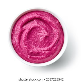 bowl of beetroot hummus isolated on white background, top view - Shutterstock ID 2037225542