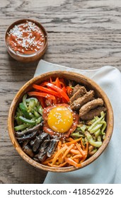 Bowl Of Bibimbap On The Wooden Table