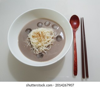 A Bowl Of Black Bean Soup Noodles