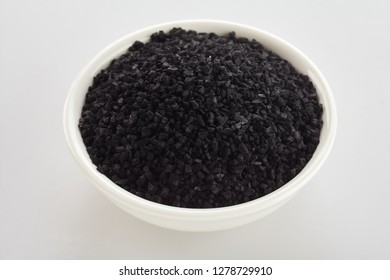 Bowl of black Hawaiian lava salt blended with activated charcoal for a healthy detoxifying salt