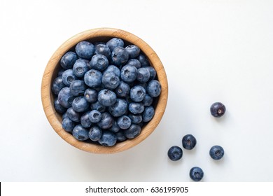 Bowl of blueberries isolated on white. Top view