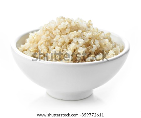 Bowl of boiled Quinoa seeds isolated on white background