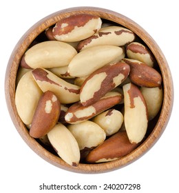 Bowl With Brazil Nuts. Raw Brazil Nuts In A Wooden Bowl From Above, Isolated On White Background.