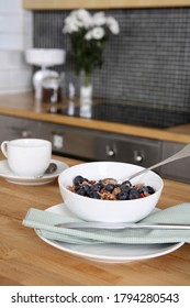 A Bowl Of Breakfast Cereal And A Cup Of Coffee On The Kitchen Counter. Conceptual Image