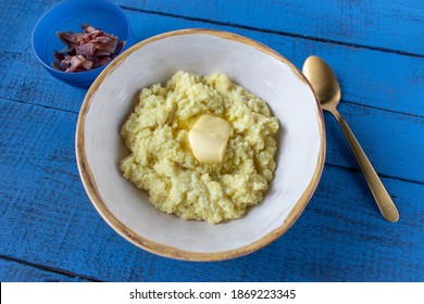 Bowl Of Breakfast Grits With Butter Top View