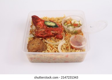 A Bowl Of Briyani Rice With Chicken On White Table