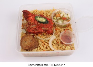 A Bowl Of Briyani Rice With Chicken On White Table