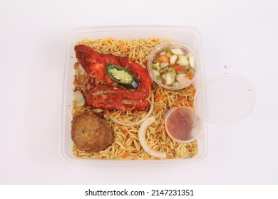 A Bowl Of Briyani Rice With Chicken On White Table