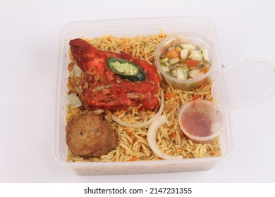 A Bowl Of Briyani Rice With Chicken On White Table