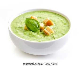 bowl of broccoli and green peas cream soup isolated on white background