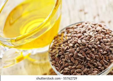 Bowl Of Brown Flax Seed And Linseed Oil