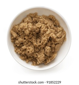 Bowl Of Brown Sugar, Isolated On White.  Overhead View.