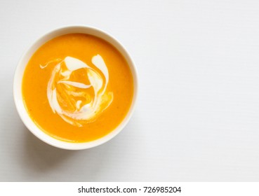 Bowl Of Butternut Squash Soup On A White Background,isolated,squash Soup,top View