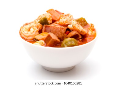 A Bowl Of Cajun Seafood Gumbo On A White Background