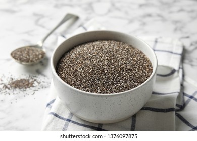 Bowl With Chia Seeds On Marble Background