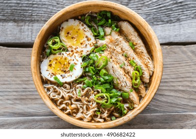 Bowl Of Chicken Ramen Soup On The Wooden Table