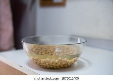 A Bowl Of Chickpeas Soaking With Water