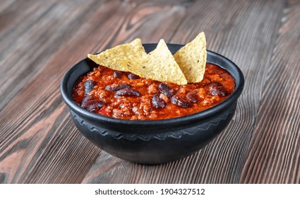 Bowl Of Chili Con Carne On A Wooden Table