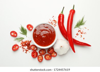 Bowl With Chilli Sauce, Pepper And Garlic On White Background