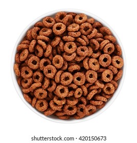 Bowl with chocolate corn rings isolated on white background. Top view.