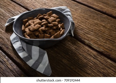 Bowl of chocolate toast crunch with napkin on wooden table - Powered by Shutterstock