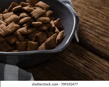 Bowl of chocolate toast crunch with napkin on wooden table - Powered by Shutterstock