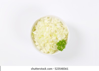 Bowl Of Chopped Raw Onion On White Background