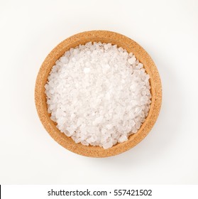 bowl of coarse grained salt on white background