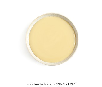 Bowl With Condensed Milk On White Background, Top View. Dairy Product