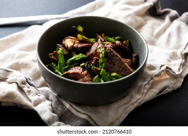 Bowl With Cooked Beef Chunks And Asparagus For Healthy Meal