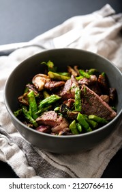 Bowl With Cooked Beef Chunks And Asparagus For Healthy Meal