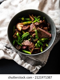 Bowl With Cooked Beef Chunks And Asparagus For Healthy Meal