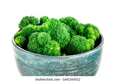 A Bowl Of Cooked Broccoli Close-up On A White Background